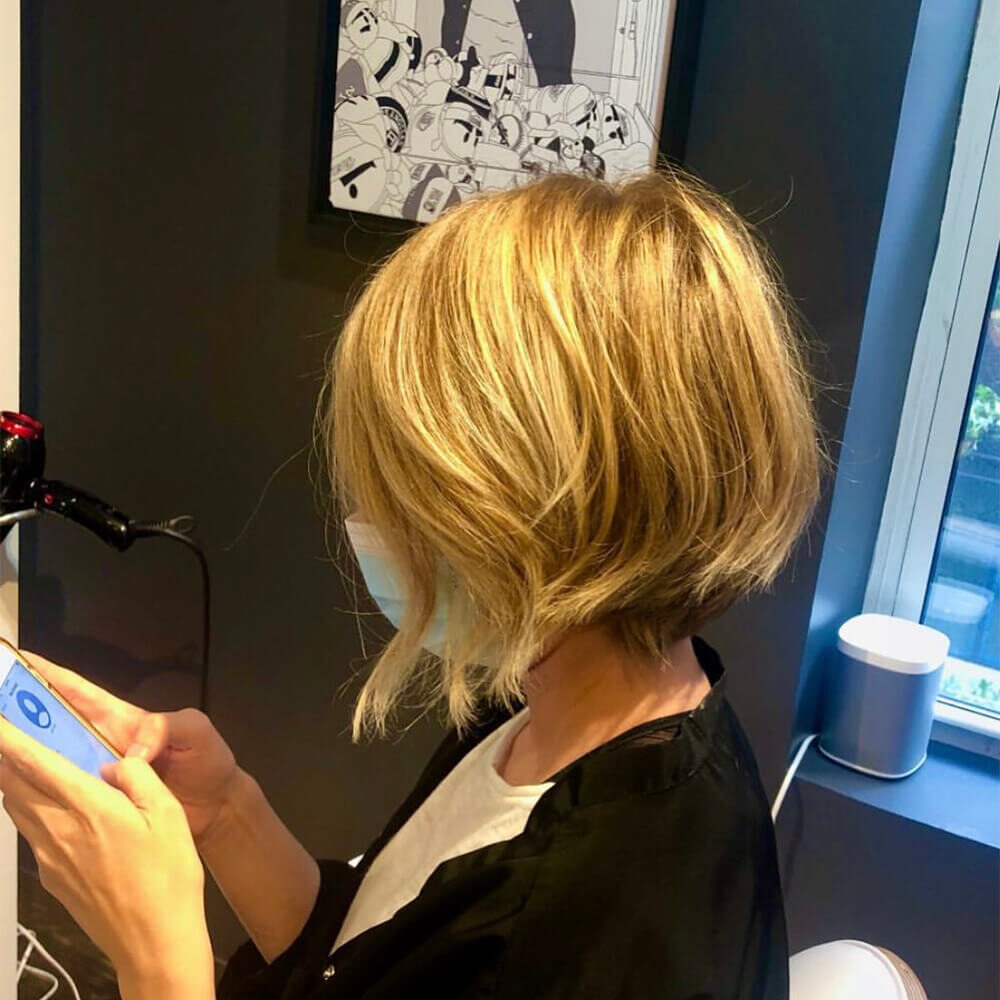 Blonde bob finished with a gloss on the salon floor at Red Market New York