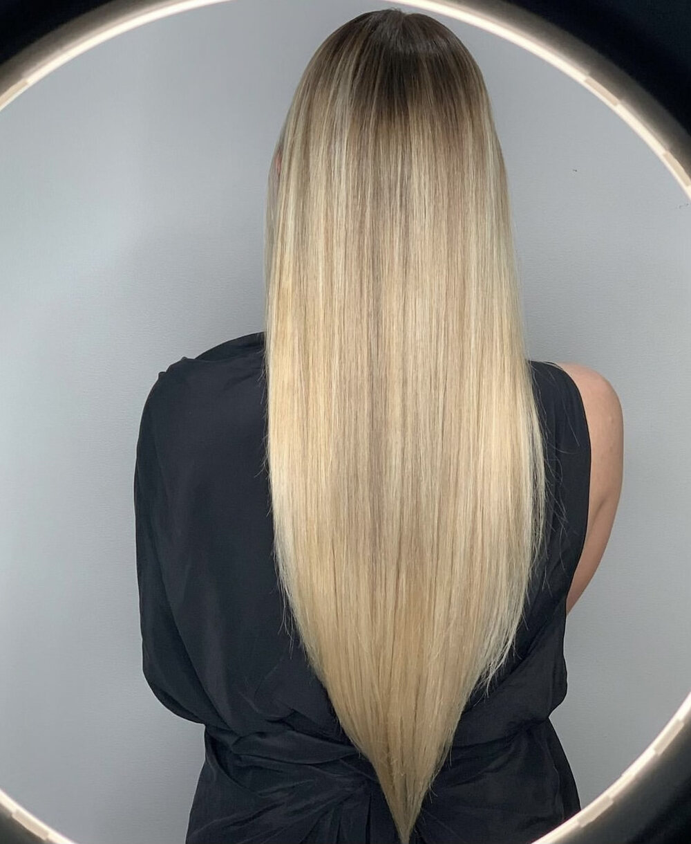 Platinum blonde straight blowout by Red Market New York colorist Saudy Lara