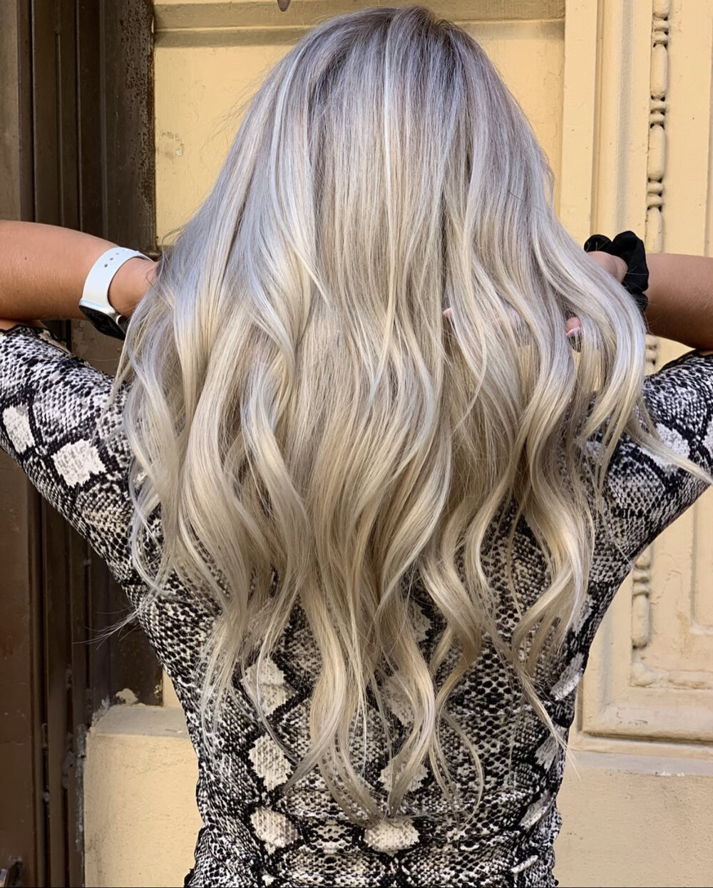 Silver-blonde balayage with soft waves by Red Market New York colorist Saudy Lara