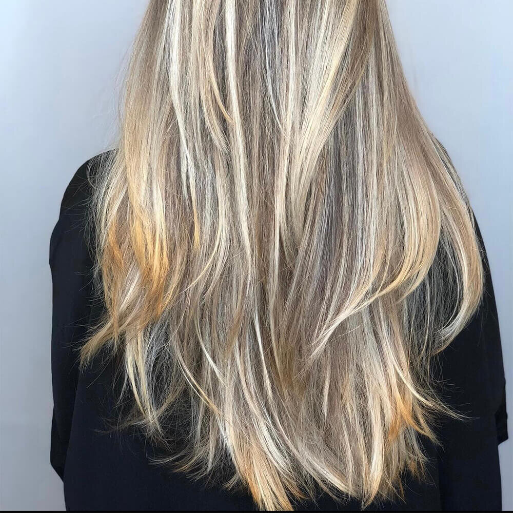 Long silver-blonde hair with a soft gloss, coloured at Red Market New York